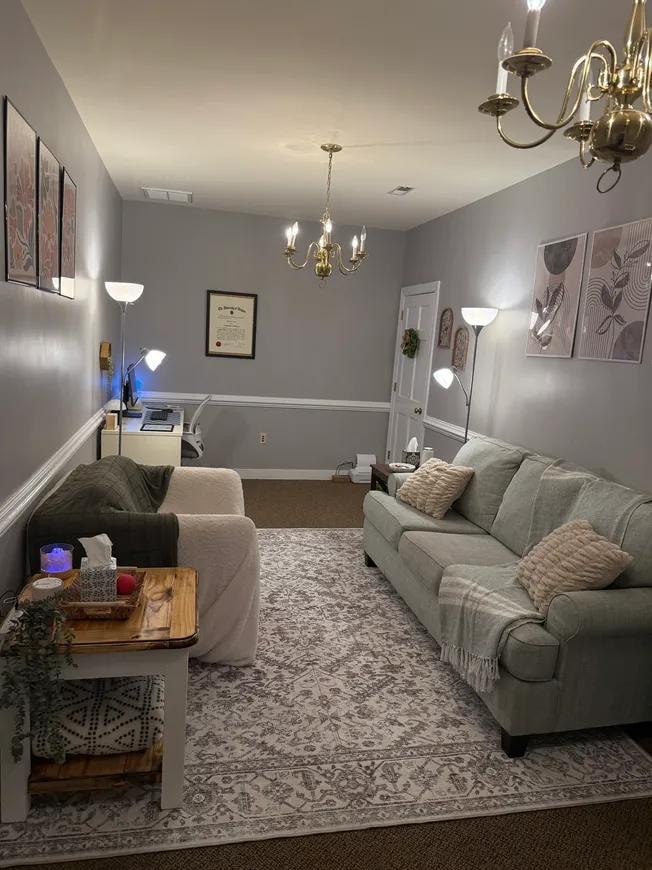 Office suite main room with chandelier and comfortable seating