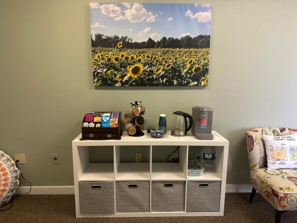 Tea and coffee station with sunflower artwork