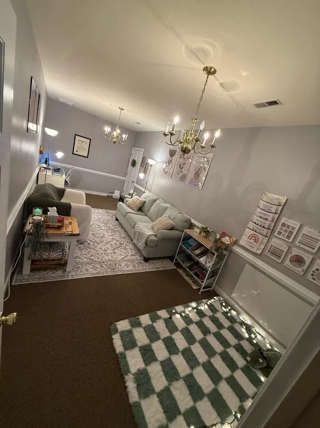 Office entrance with checkered rug and string lights